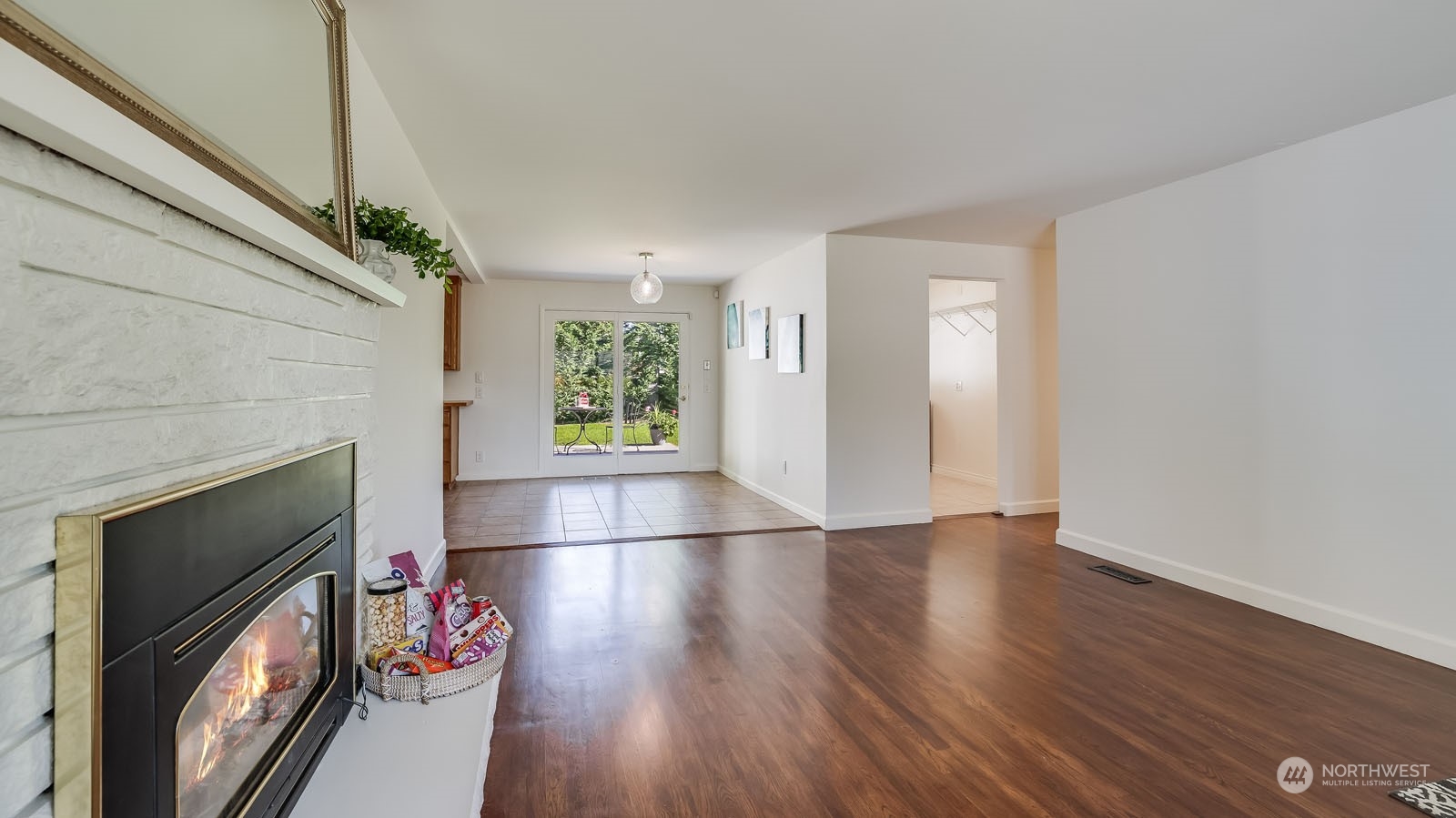 4324 Northeast 11th Street Renton, WA 98059 - Photo 5 of 22 a view of an empty room with wooden floor and a window