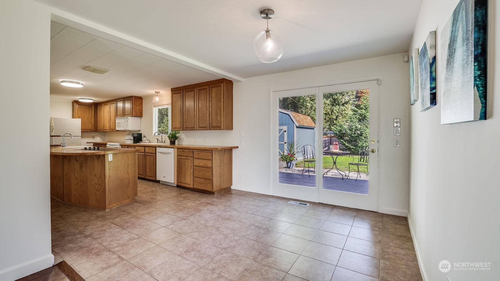 4324 Northeast 11th Street Renton, WA 98059 - Photo 6 of 22 a kitchen with stainless steel appliances granite countertop a refrigerator sink and stove