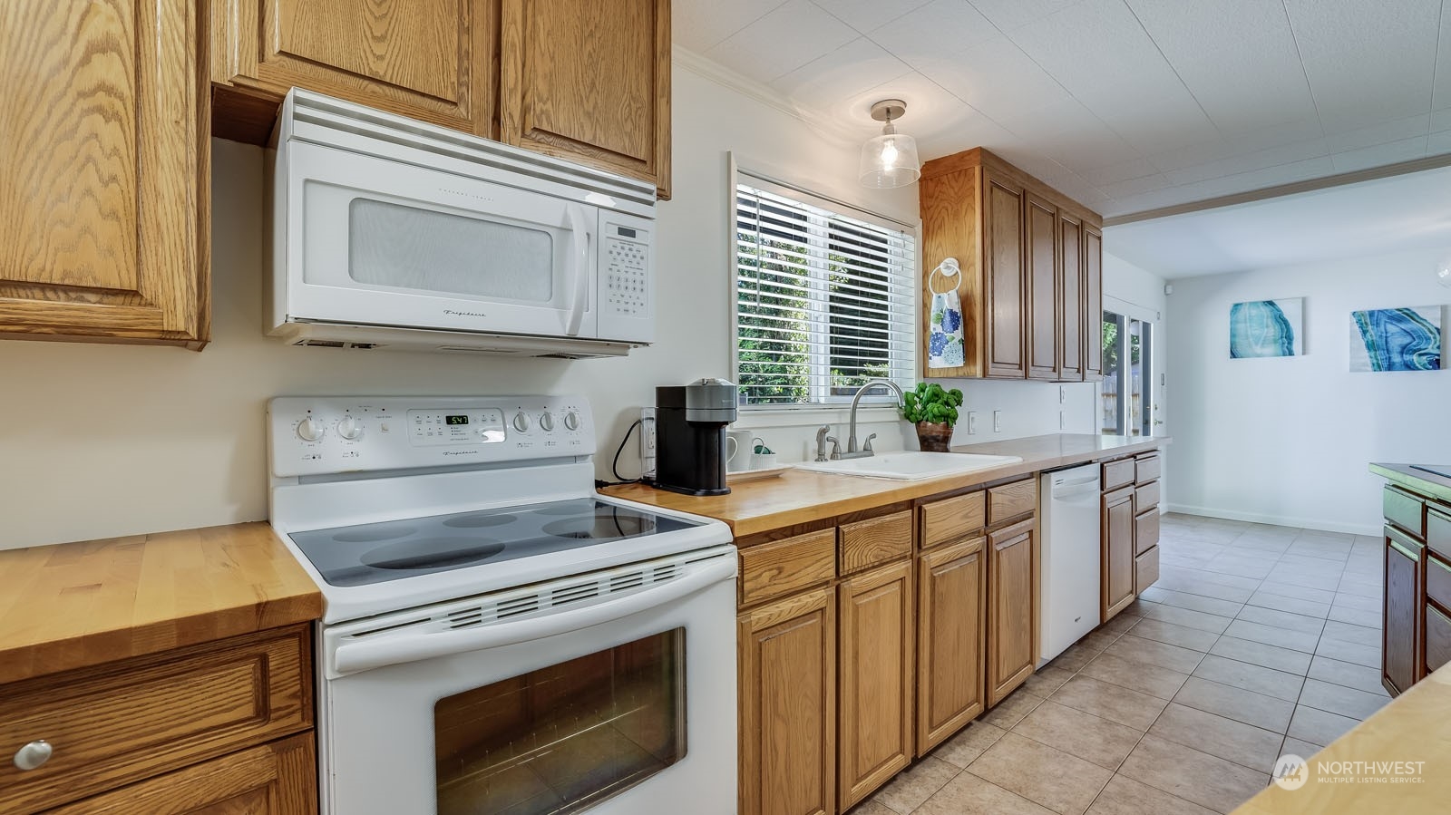 4324 Northeast 11th Street Renton, WA 98059 - Photo 9 of 22 a kitchen with a stove and a sink