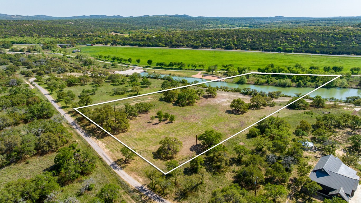 Lot 2 Byrd Ranch Road Johnson City, TX 78636 - Photo 1 of 40 an aerial view of a house with a garden