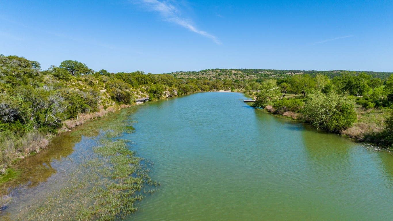 Lot 2 Byrd Ranch Road Johnson City, TX 78636 - Photo 38 of 40 a view of a lake with houses in the back