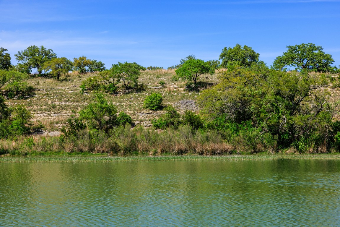 Lot 2 Byrd Ranch Road Johnson City, TX 78636 - Photo 5 of 40 a view of a lake with houses with outdoor space