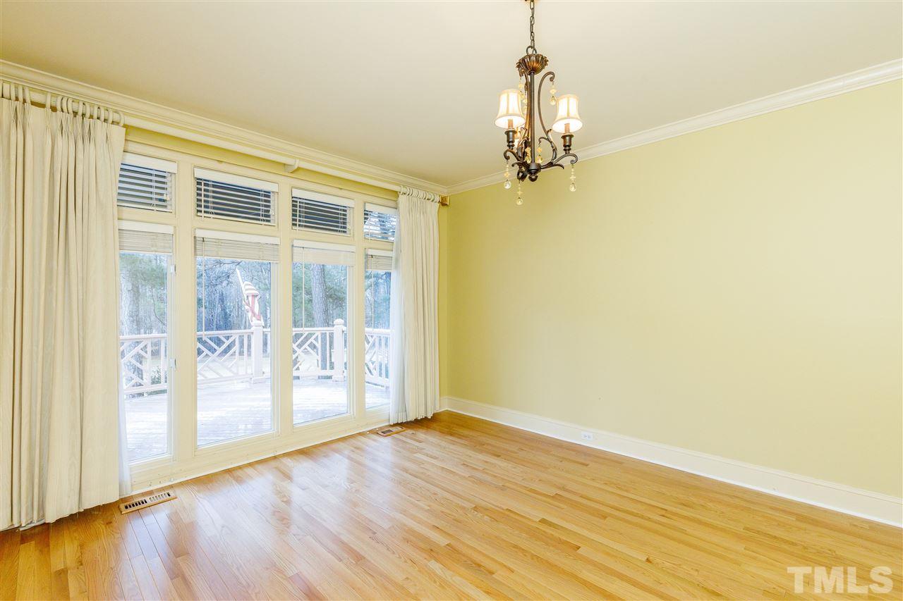 2968 Tillinghast Trail Raleigh, NC 27613 - Photo 14 of 28 a view of empty room with wooden floor and fan