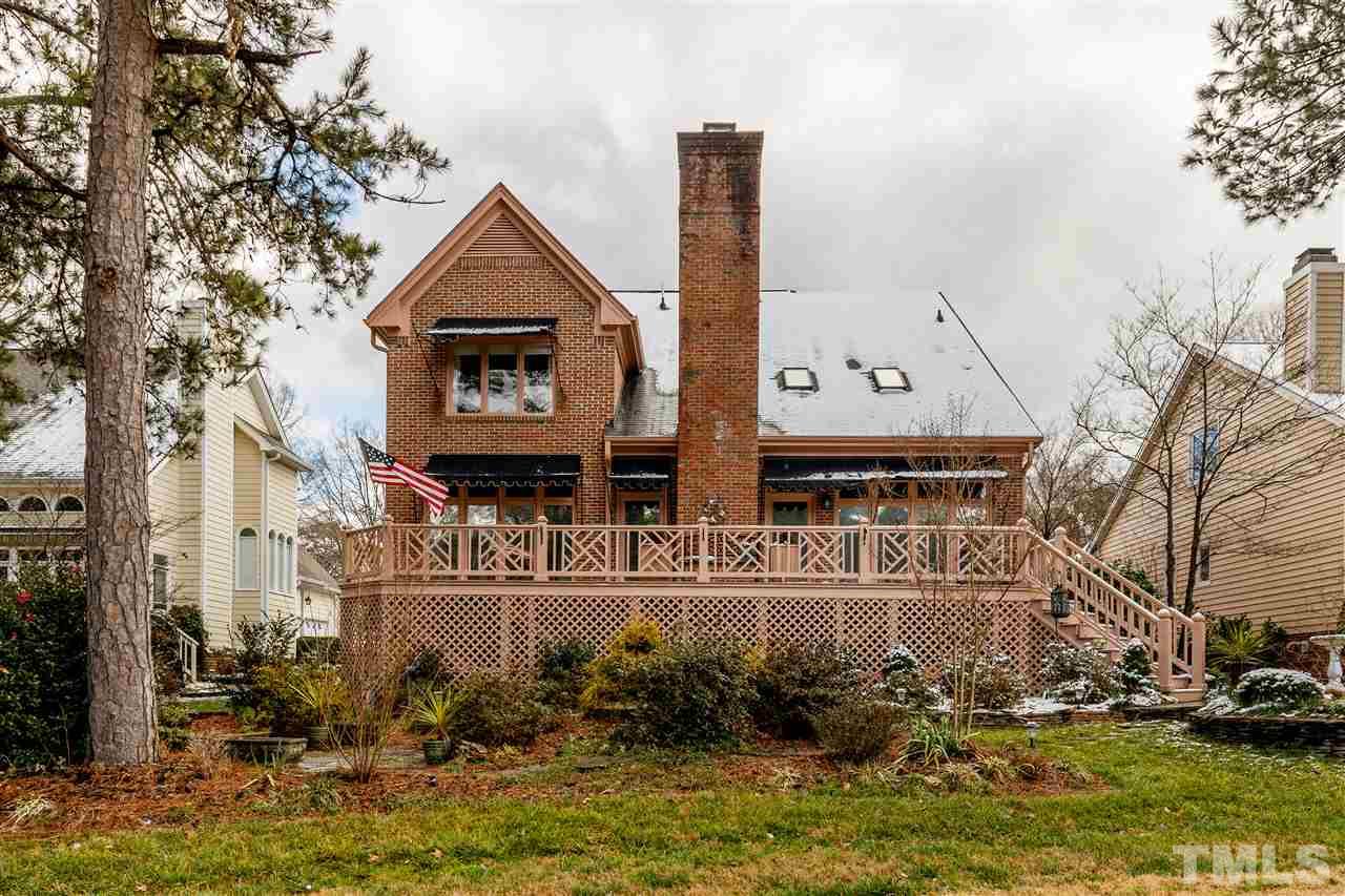 2968 Tillinghast Trail Raleigh, NC 27613 - Photo 28 of 28 a view of a house with a small yard and large trees