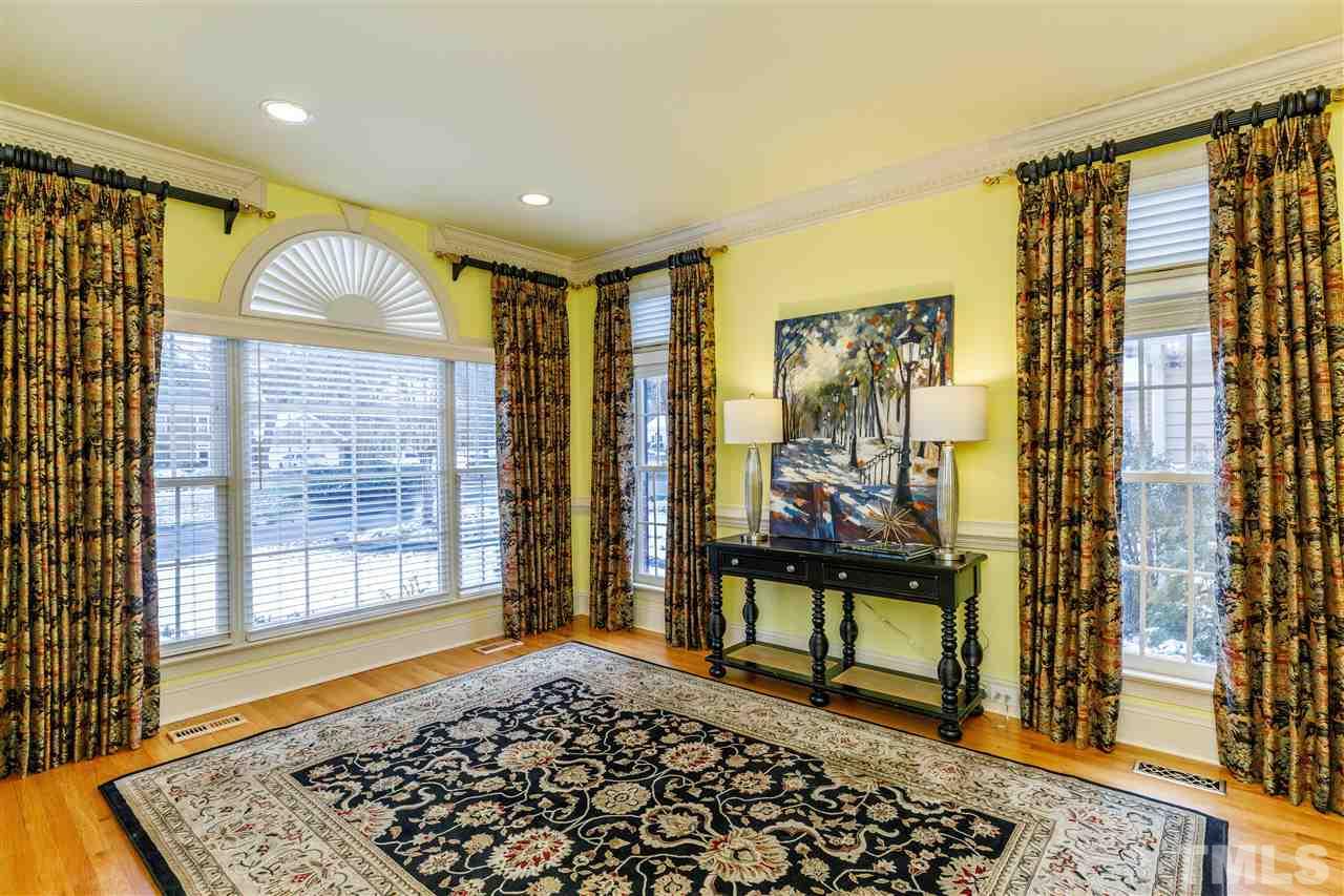 2968 Tillinghast Trail Raleigh, NC 27613 - Photo 10 of 28 a living room with a rug and a table