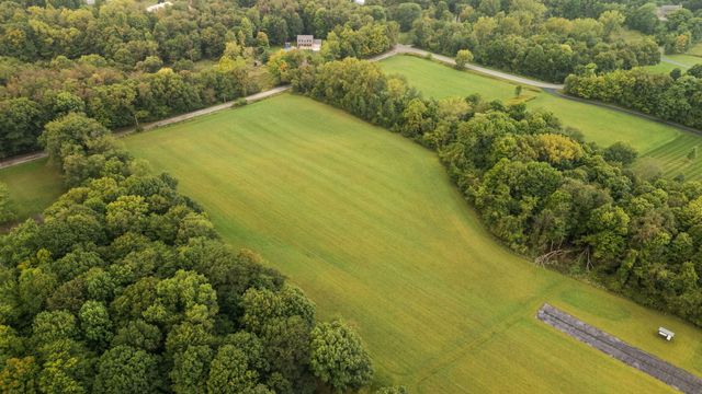 a view of a lake with a yard