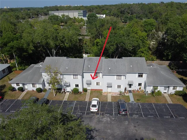 an aerial view of a house with a garden