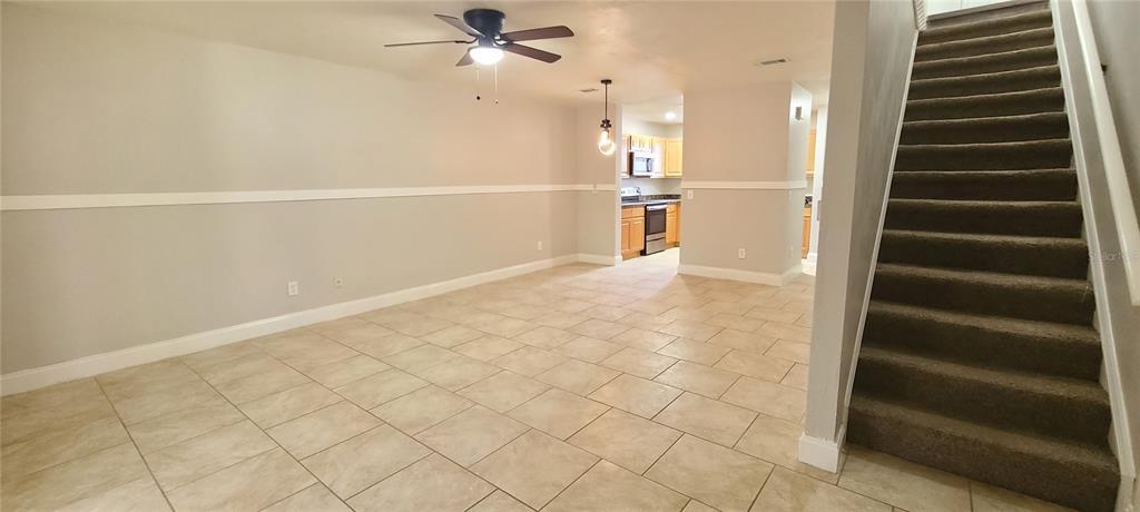 1304 Deer Springs Road Port Orange, FL 32129 - Photo 17 of 37 wooden floor in an empty room with a window