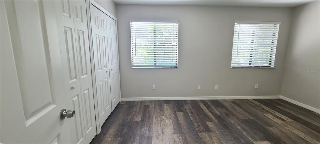 1304 Deer Springs Road Port Orange, FL 32129 - Photo 20 of 37 a view of a room with wooden floor and windows