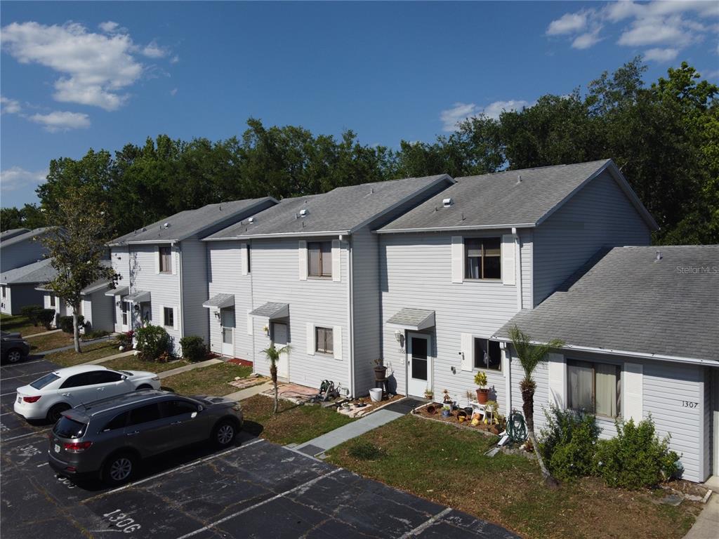 1304 Deer Springs Road Port Orange, FL 32129 - Photo 2 of 37 a front view of a house with a garden