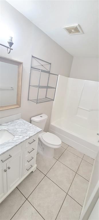 1304 Deer Springs Road Port Orange, FL 32129 - Photo 25 of 37 a bathroom with a sink toilet and vanity