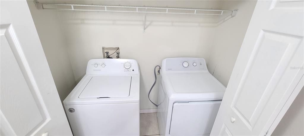 1304 Deer Springs Road Port Orange, FL 32129 - Photo 30 of 37 a utility room with dryer and washer