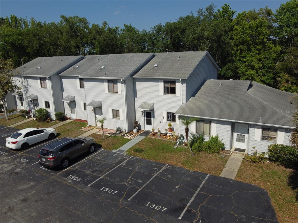 1304 Deer Springs Road Port Orange, FL 32129 - Photo 34 of 37 a couple of cars parked in front of a house