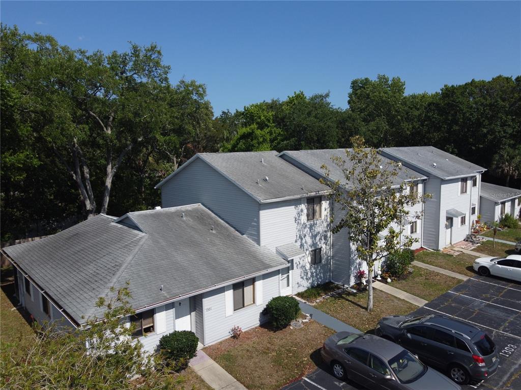 1304 Deer Springs Road Port Orange, FL 32129 - Photo 36 of 37 an aerial view of a house with garden space and trees