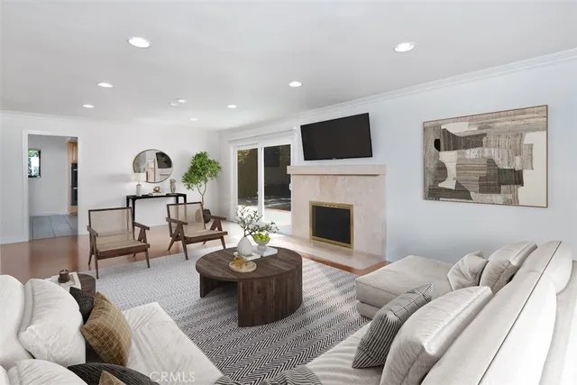 a living room with furniture fireplace and window