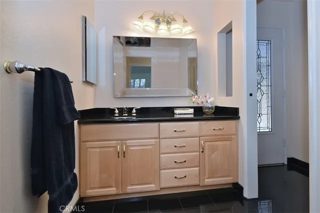 a bathroom with a sink and a mirror