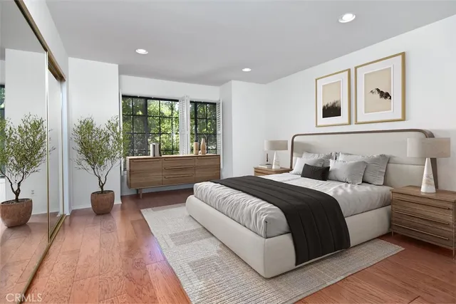 a spacious bedroom with a large bed and a couch