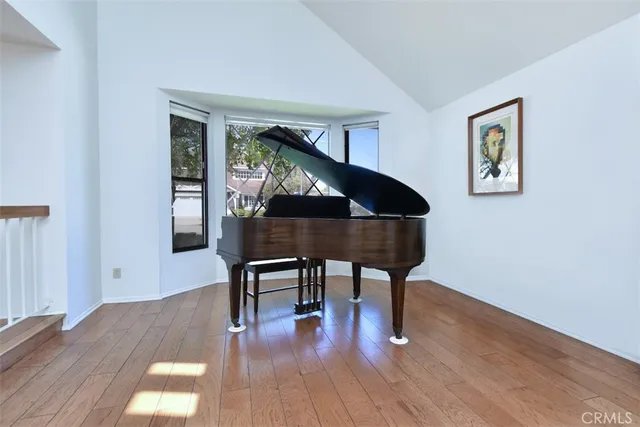 a workspace room with furniture and wooden floor