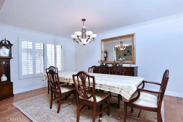 a view of a dining room with furniture and window