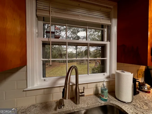 a close view of a sink and a window