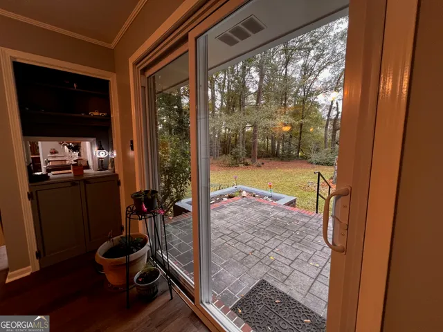 a room with wooden floor and furniture