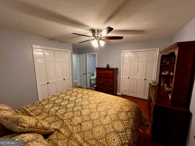 a bedroom with a bed and a walk in closet