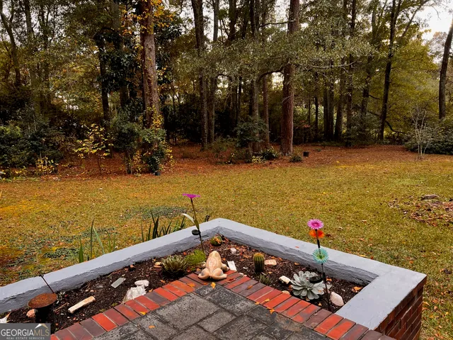 a view of a tree in front of a house