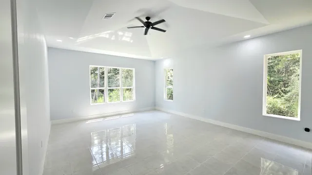a view of an empty room with a window