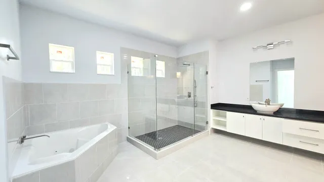 a view of a livingroom with a ceiling fan and window