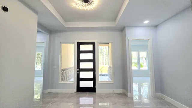 a view of kitchen with cabinets and chairs