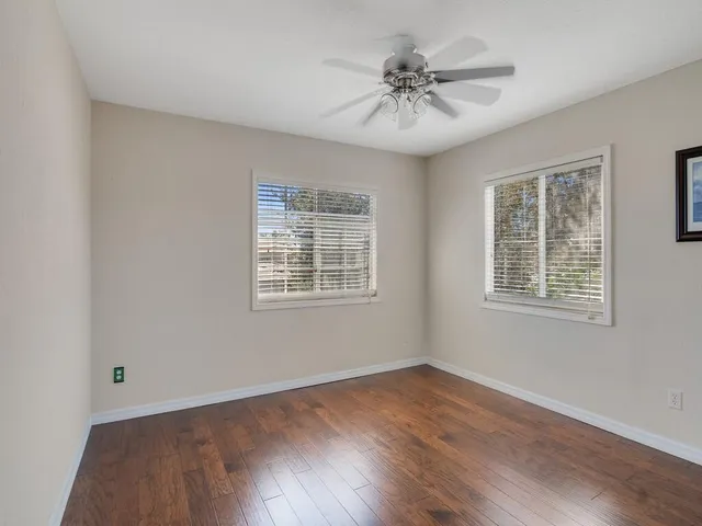 a view of a park with large trees