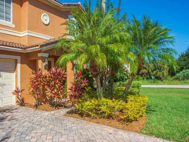 a view of a street with a houses in the back