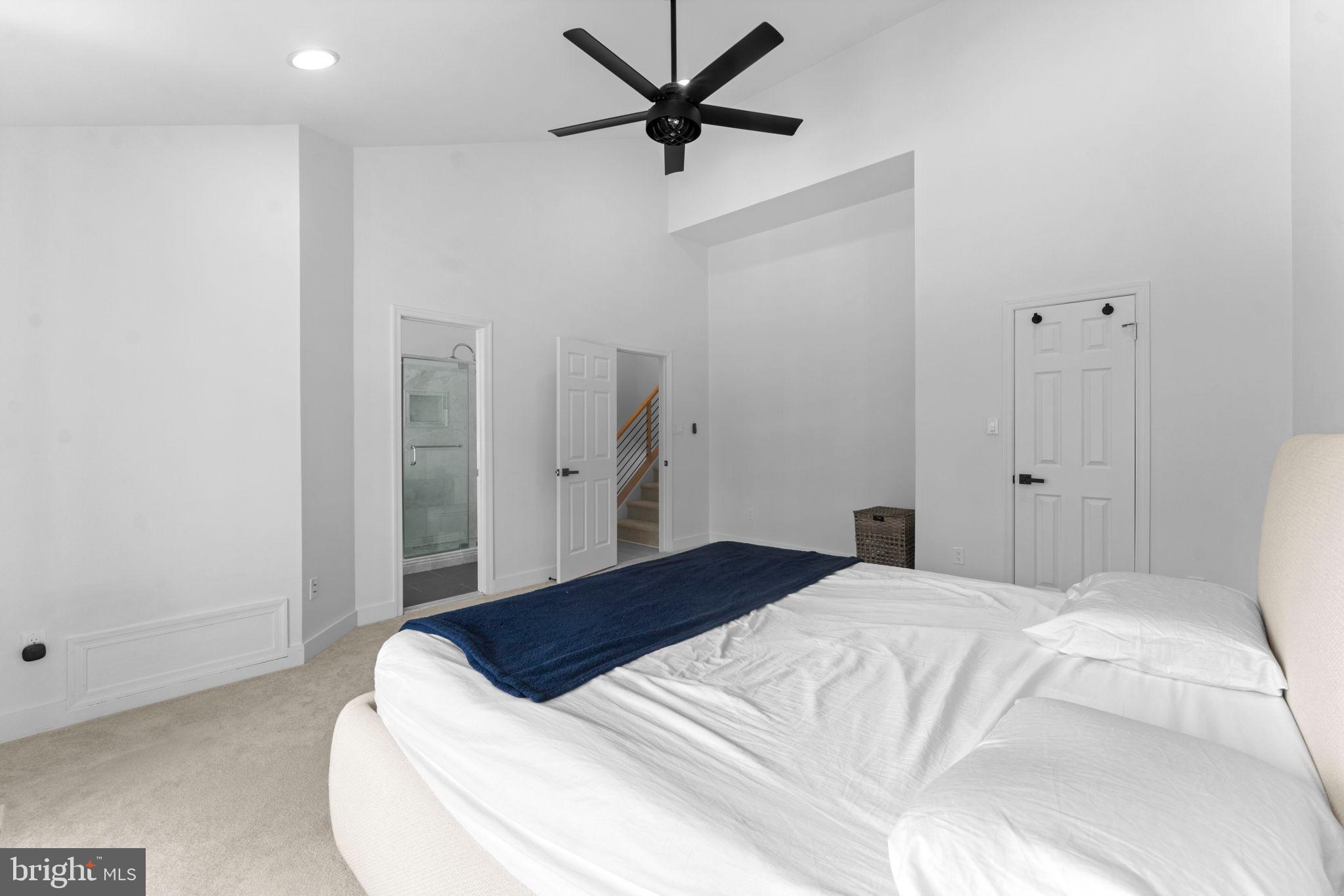 11433 Heritage Oak Court Reston, VA 20194 - Photo 21 of 47 a bedroom with a bed and a chandelier