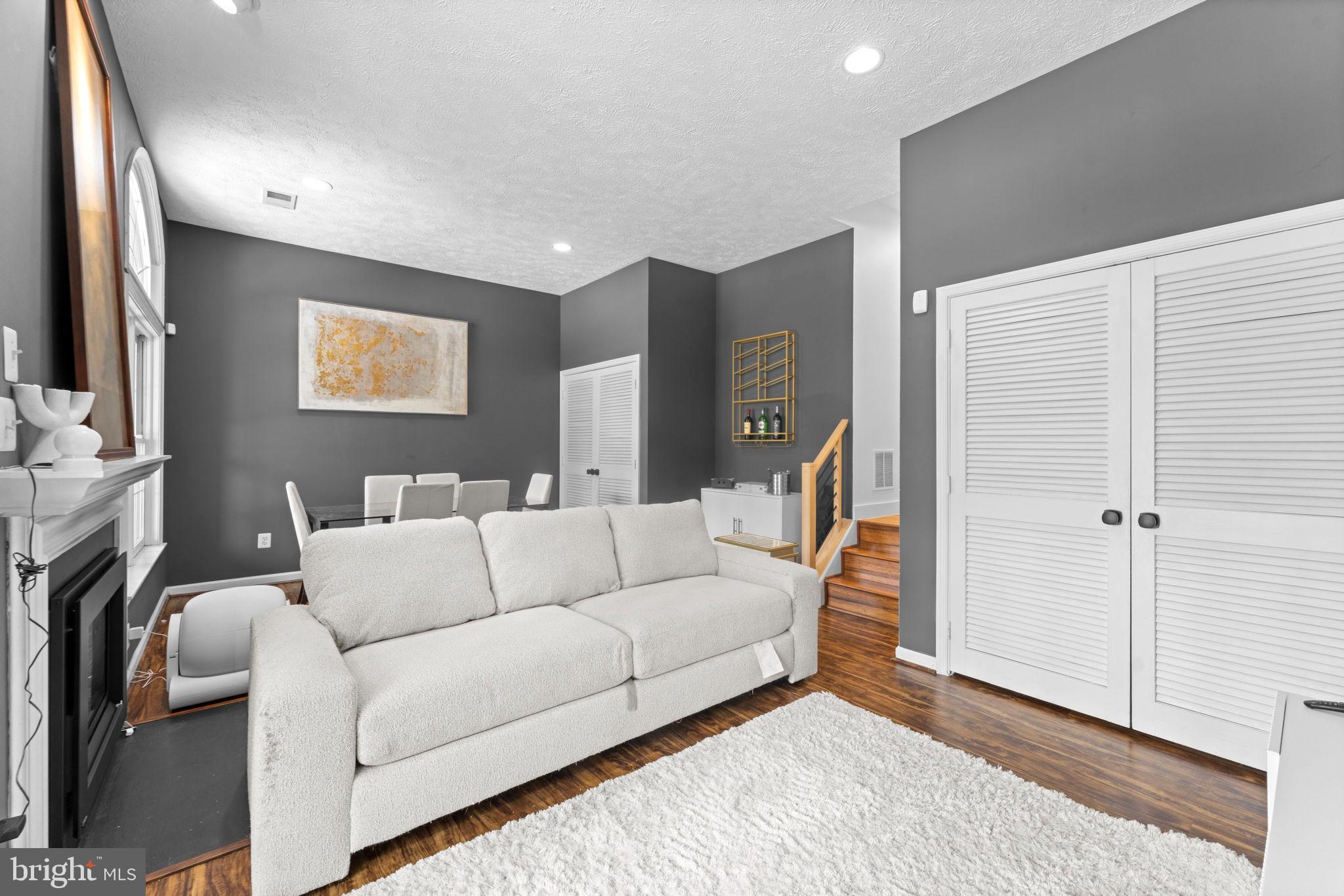 11433 Heritage Oak Court Reston, VA 20194 - Photo 38 of 47 a living room with furniture and a flat screen tv