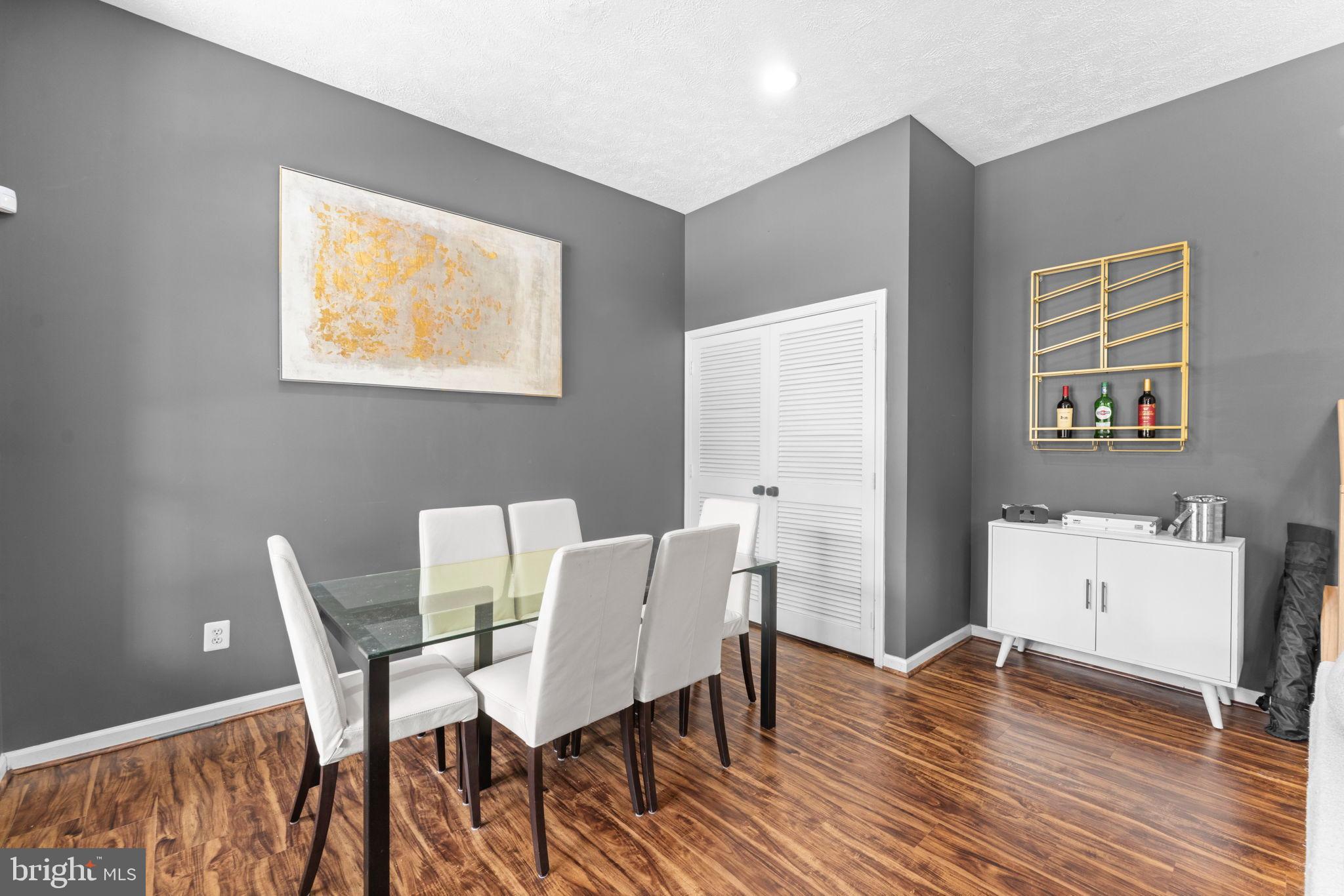 11433 Heritage Oak Court Reston, VA 20194 - Photo 39 of 47 a view of a dining room with furniture and wooden floor