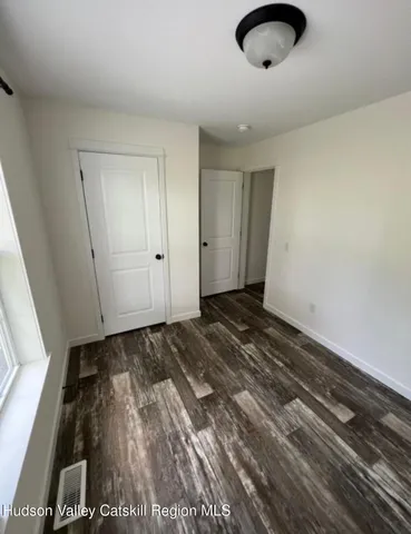 a view of a livingroom with wooden floor