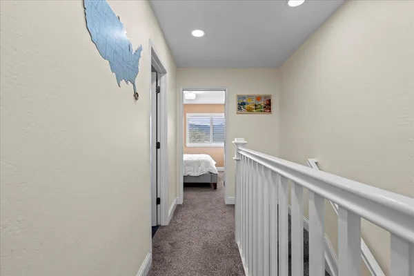 a bedroom with a large bed and a large window