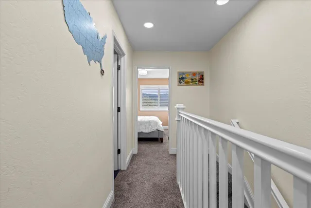 a bedroom with a large bed and a large window