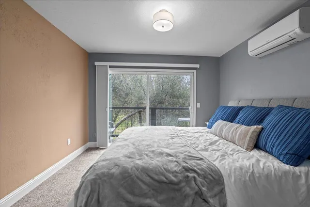 a bedroom with a bed and wall painting