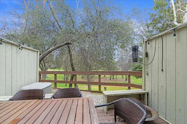 a view of a chairs and table in a balcony