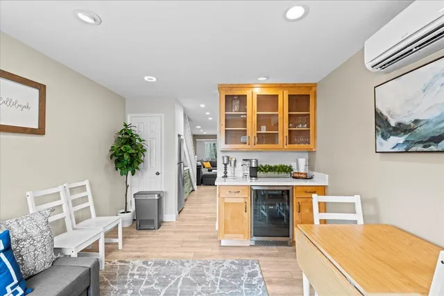a living room with furniture a window and a fireplace