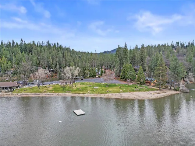 an aerial view of a house with a lake view