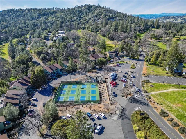 a view of a swimming pool with a patio and a mountain view