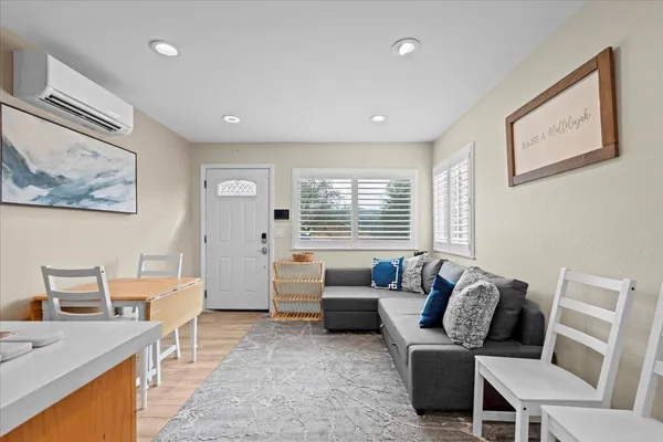 a living room with furniture and a window