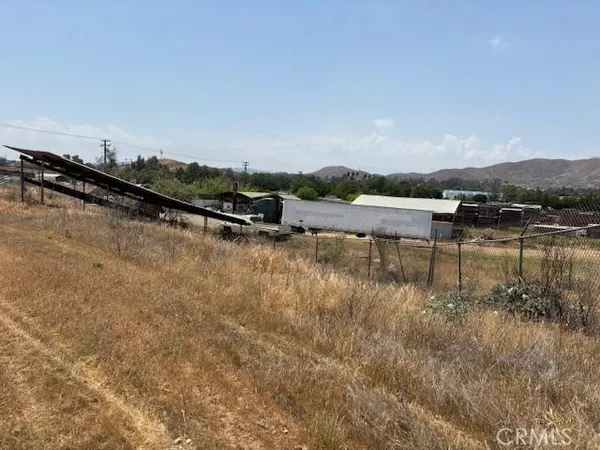 a view of a lake with houses in the back
