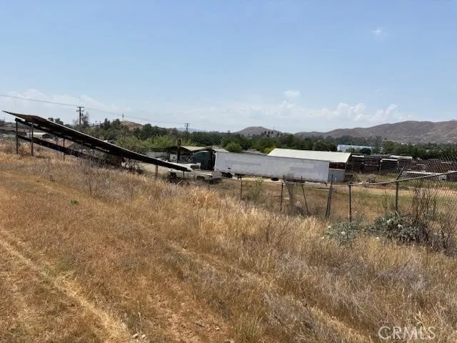 a view of a lake with houses in the back