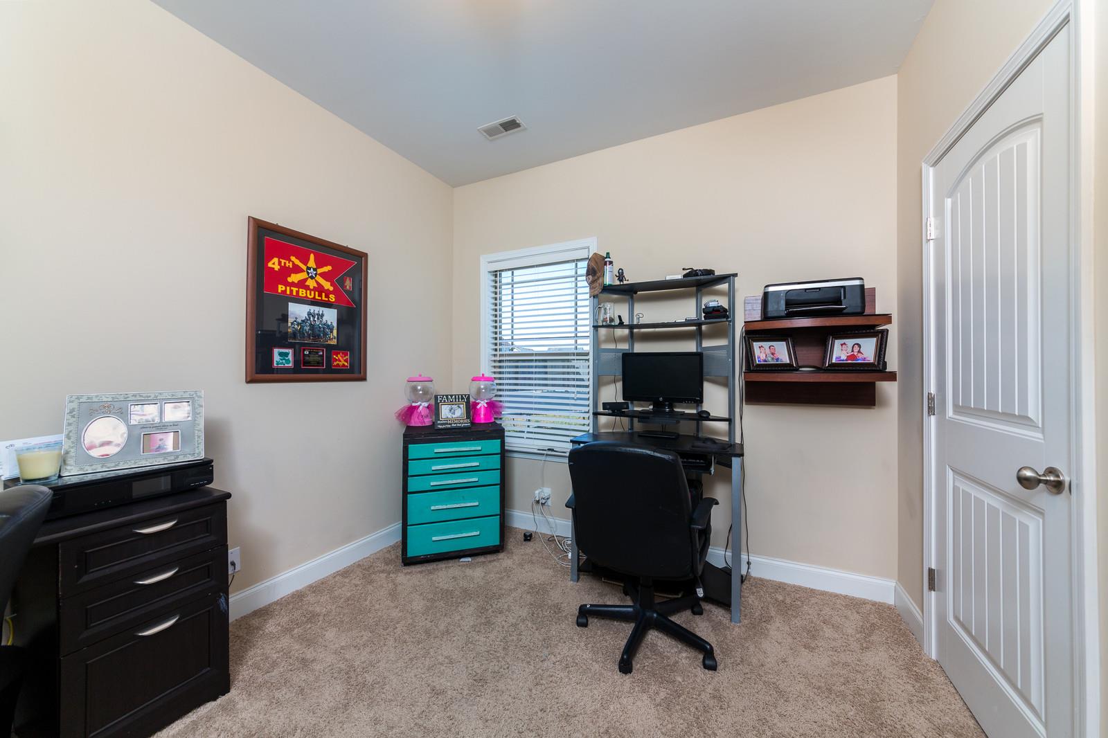 2340 Pea Ridge Road Clarksville, TN 37040 - Photo 11 of 25 a view of a workspace with furniture and a window