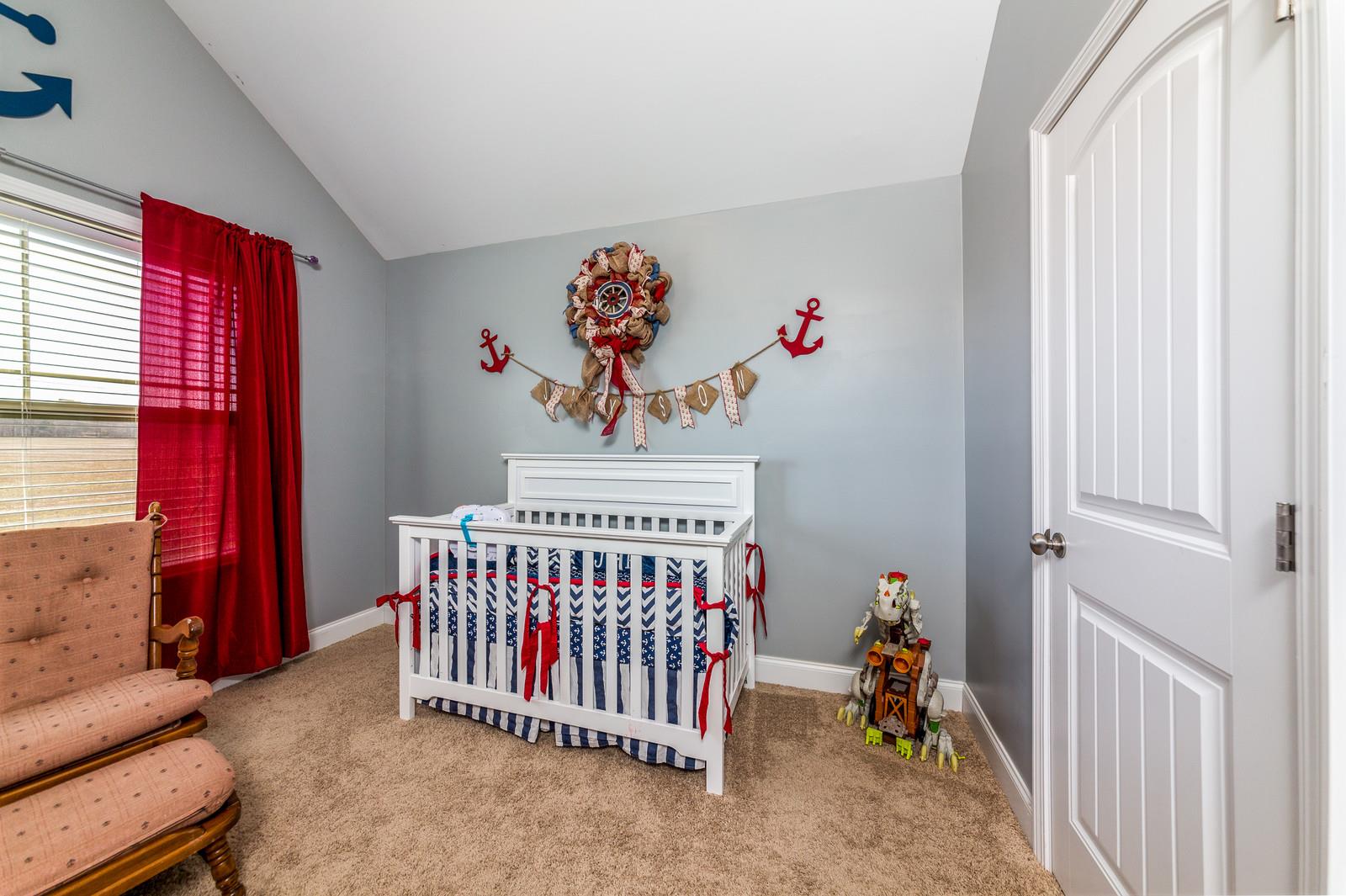 2340 Pea Ridge Road Clarksville, TN 37040 - Photo 15 of 25 a bedroom with furniture and a large window