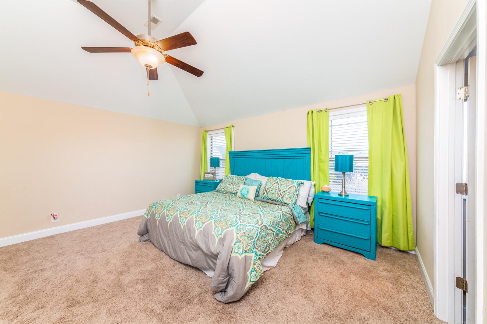 2340 Pea Ridge Road Clarksville, TN 37040 - Photo 18 of 25 a bedroom with a bed and a chandelier