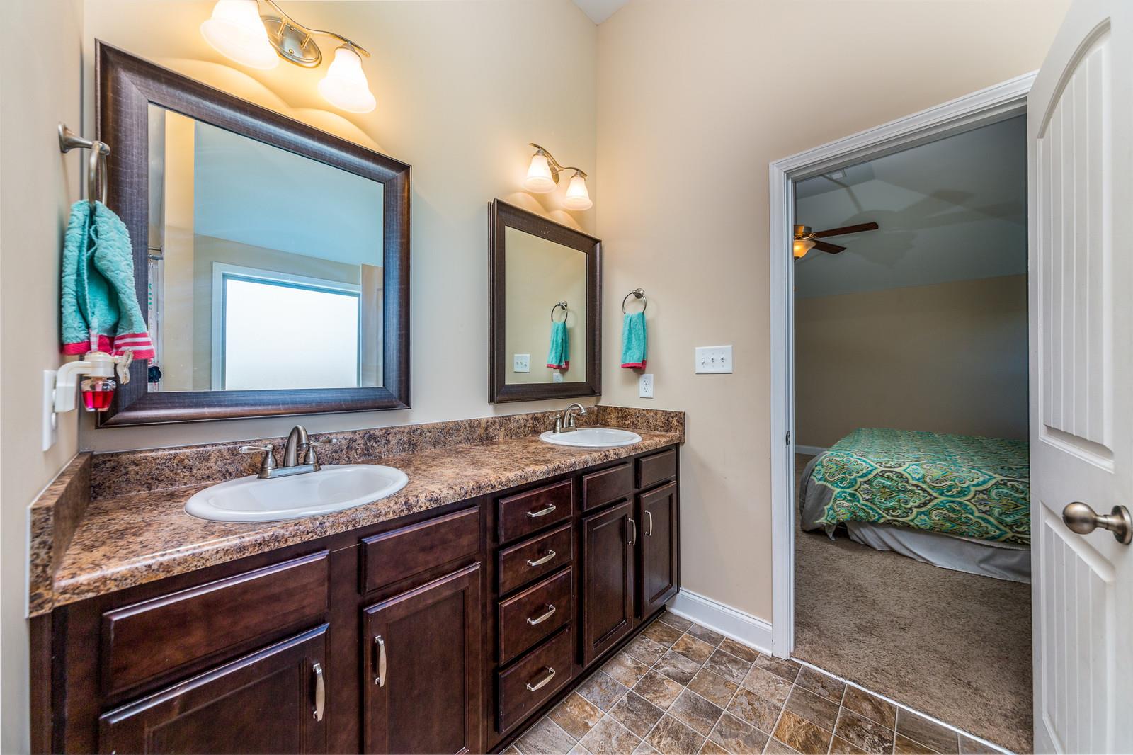 2340 Pea Ridge Road Clarksville, TN 37040 - Photo 19 of 25 a bathroom with a granite countertop sink and a mirror